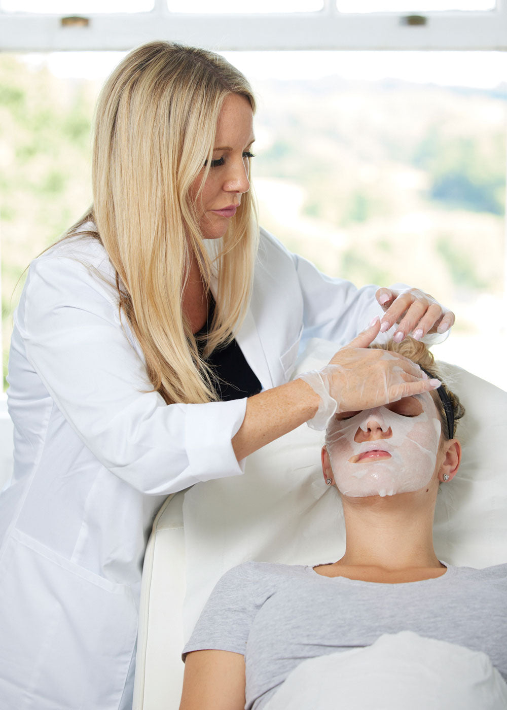 Dr Johanna Ward placing facial mask